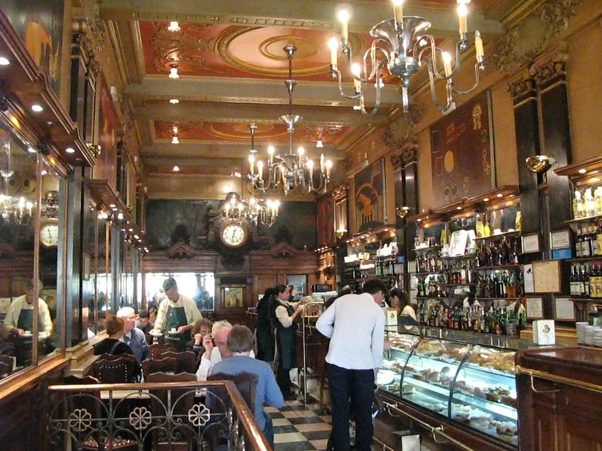 Lisbon A Brasileira cafe in Chiado neighbourhood with Art Nouveau facade and Fernando Pessoa bronze statue outside