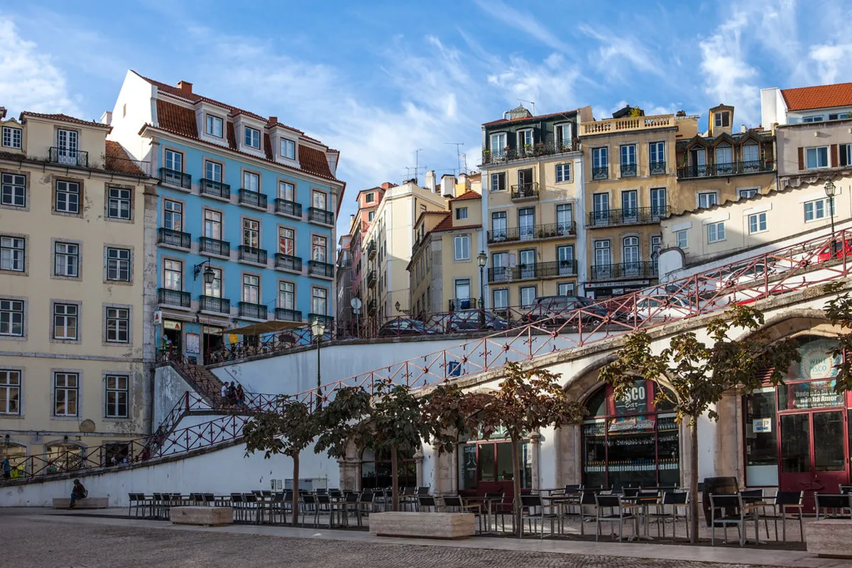 Lisbon Baixa district grand traditional cafe facade near Rossio Square at golden hour