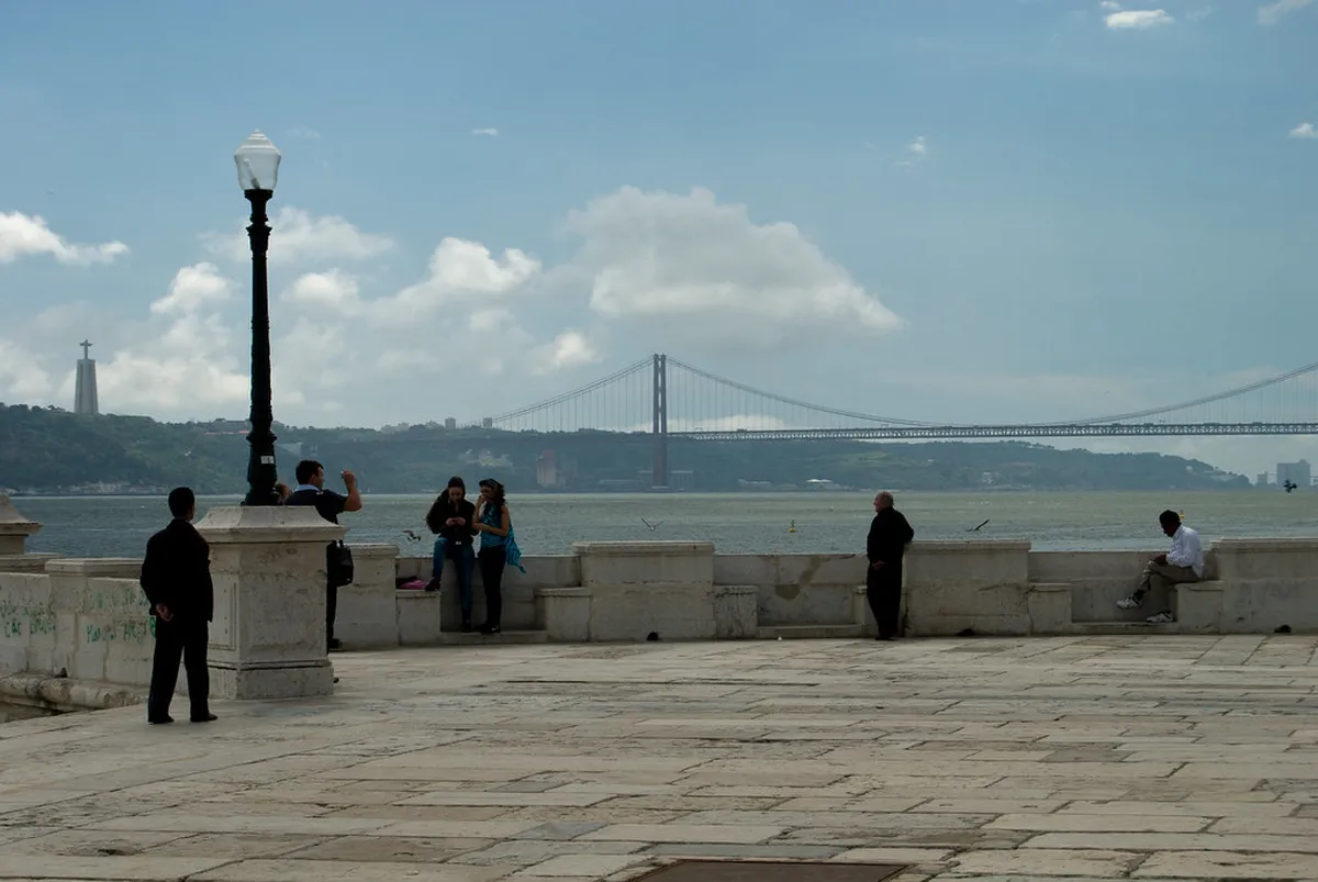 A beautifully ornate historic fountain in Lisbon near a church, reflecting the city's water and faith heritage