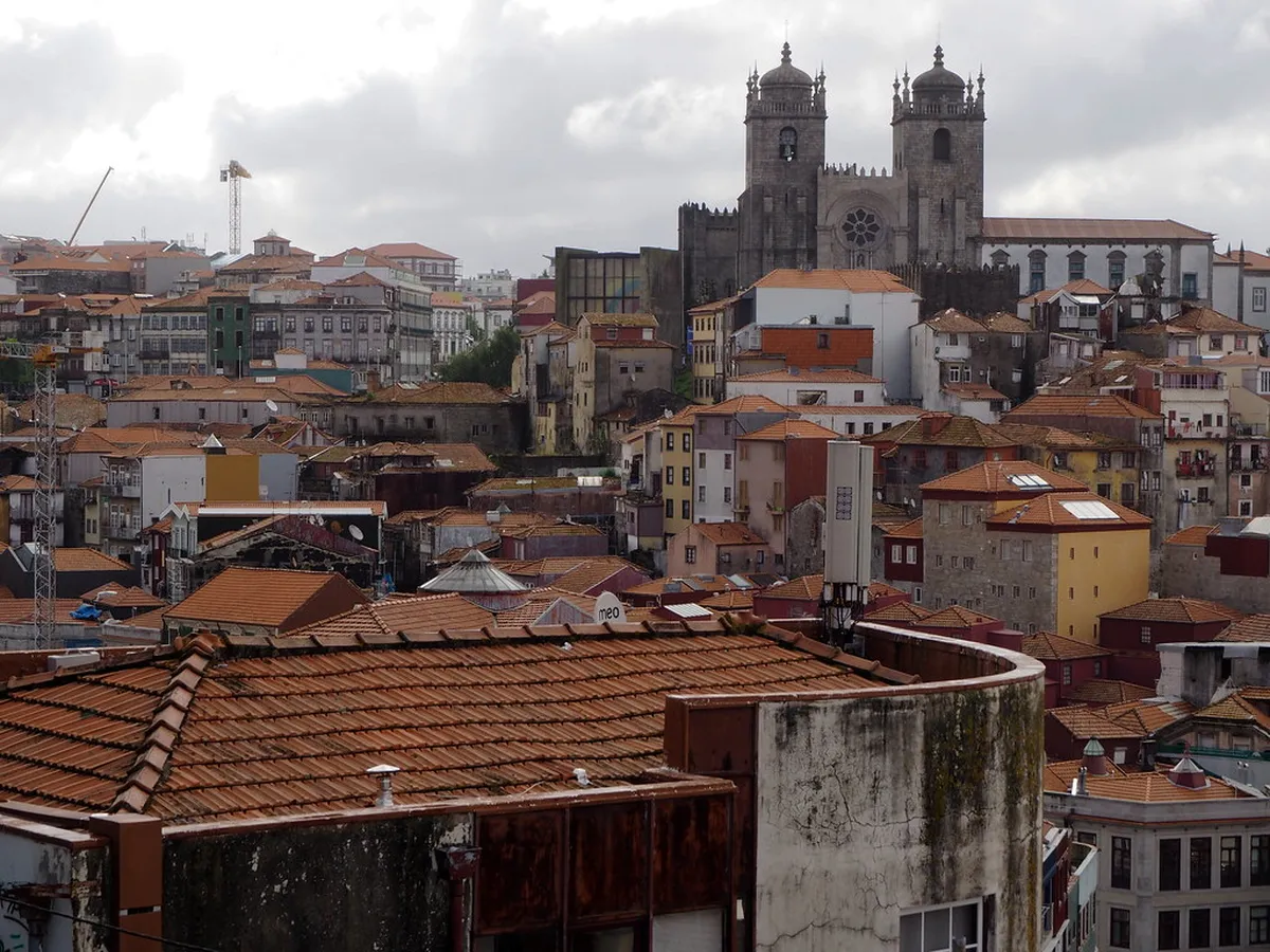 Sweeping Porto panorama from Miradouro da Vitória, showcasing the Douro River, terracotta rooftops and Dom Luís I Bridge