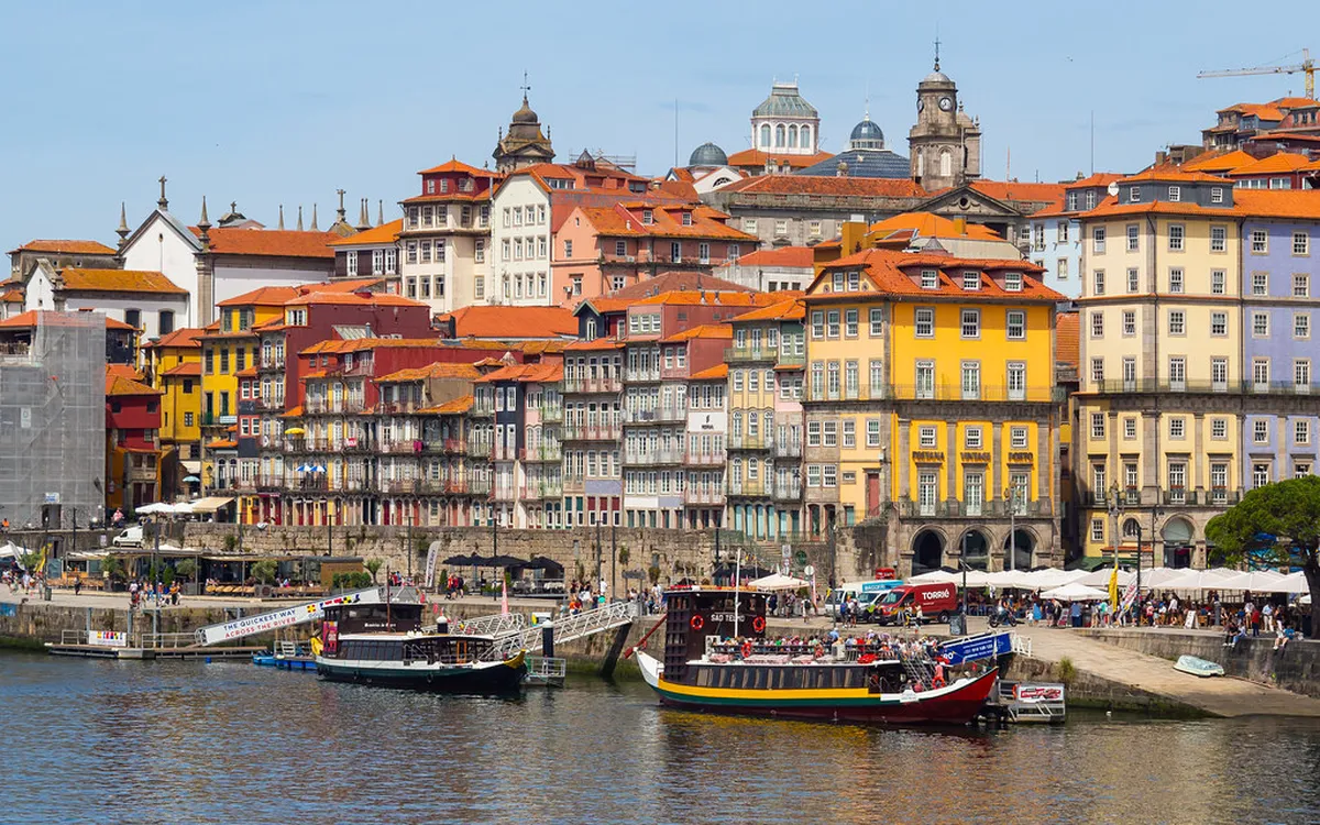 Porto old town pier with colourful riverside buildings lining the Douro waterfront
