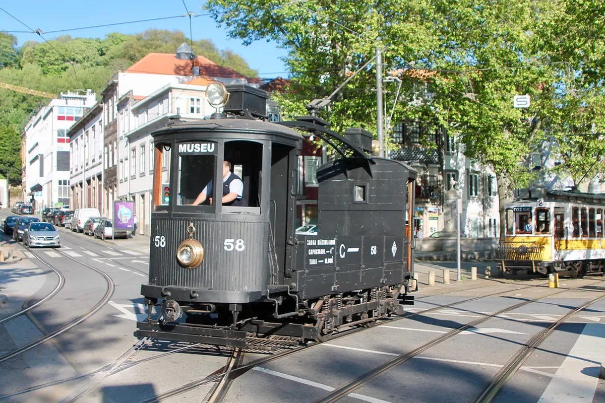 Porto tram passing through the quiet Massarelos neighbourhood on a tree-lined street away from the tourist crowds
