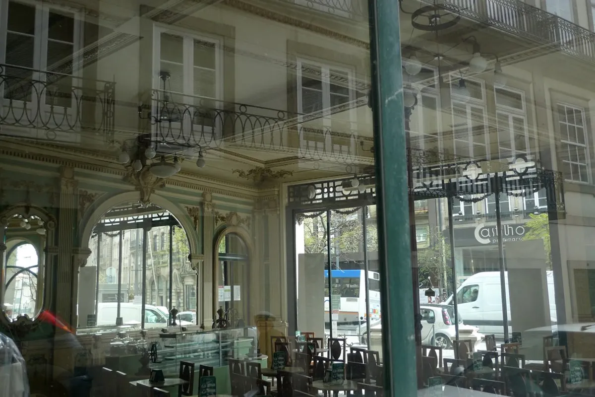Cozy Porto cafe street in Cedofeita district with tables, artisan coffee and local atmosphere