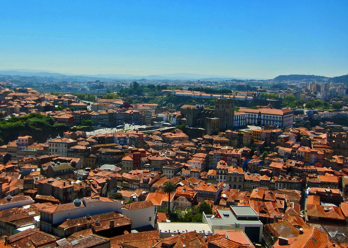 Sweeping panoramic views of Porto's rooftops and the Douro River seen from the top of Clérigos Tower