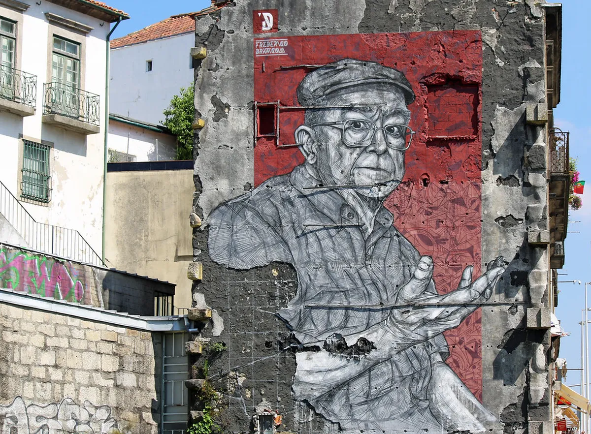 Vibrant street art mural decorating a Porto building wall in the historic neighborhood