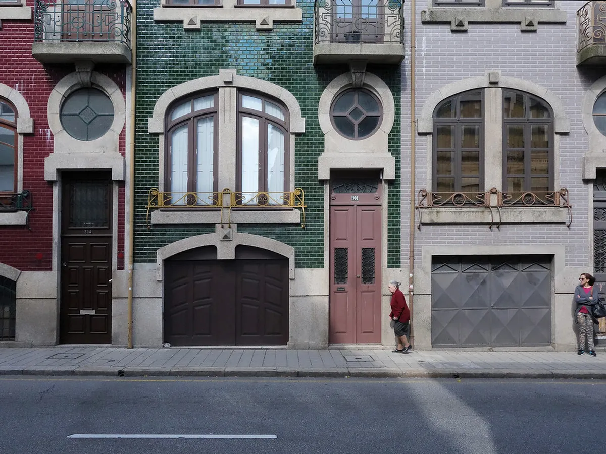 Porto Art Nouveau building facade with ornate ironwork and decorative stonework typical of the Belle Époque architectural style