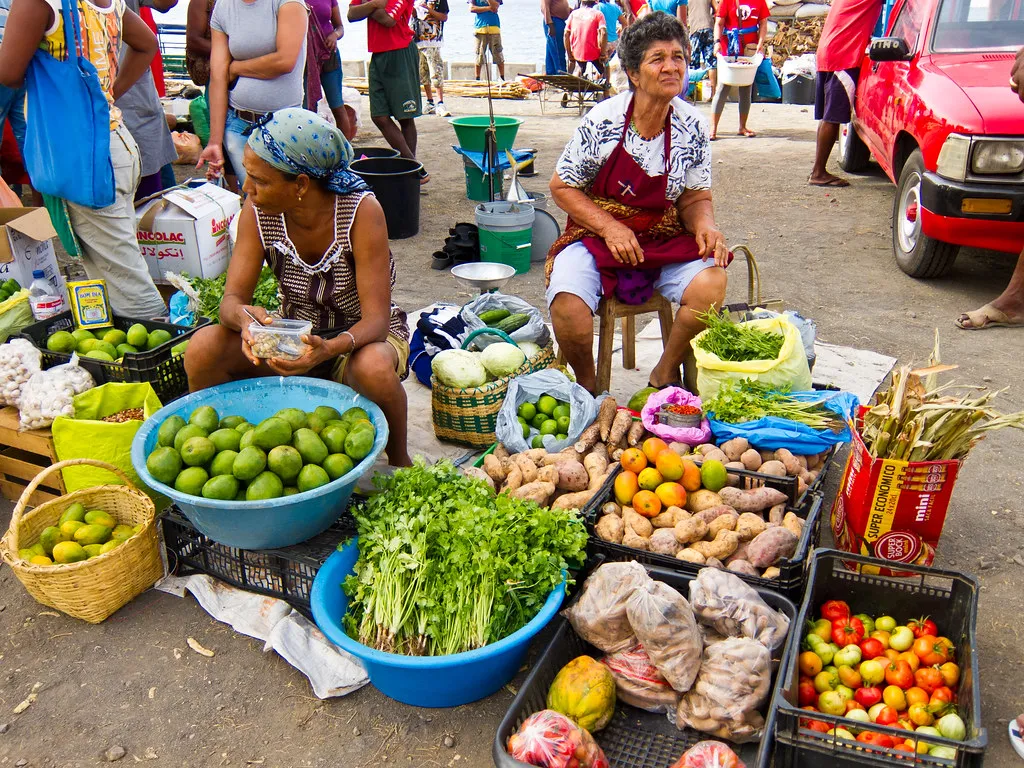 Traditional Porto market food stalls with fresh produce and local Portuguese delicacies on display