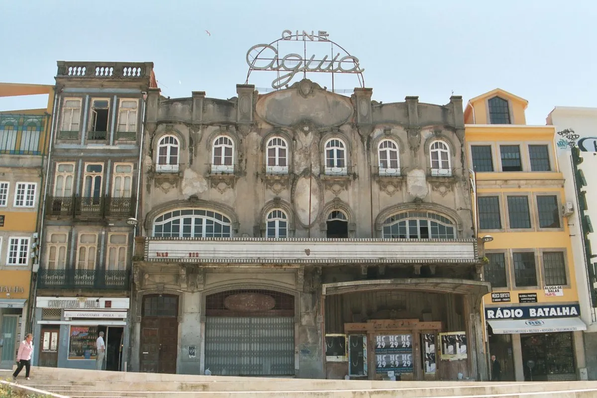 Porto Batalha Square plaza surrounded by grand historic facades and the ornate Santo Ildefonso church