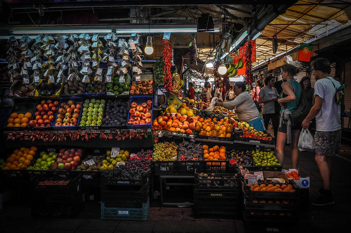 Porto Mercado do Bolhão interior stalls with fresh produce and flowers at the renovated historic market hall