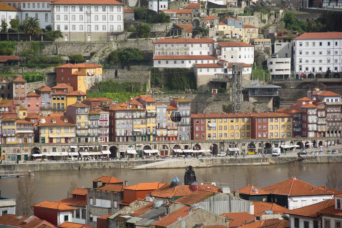 Porto luxury hotel overlooking the Douro River with elegant riverfront architecture and garden terraces