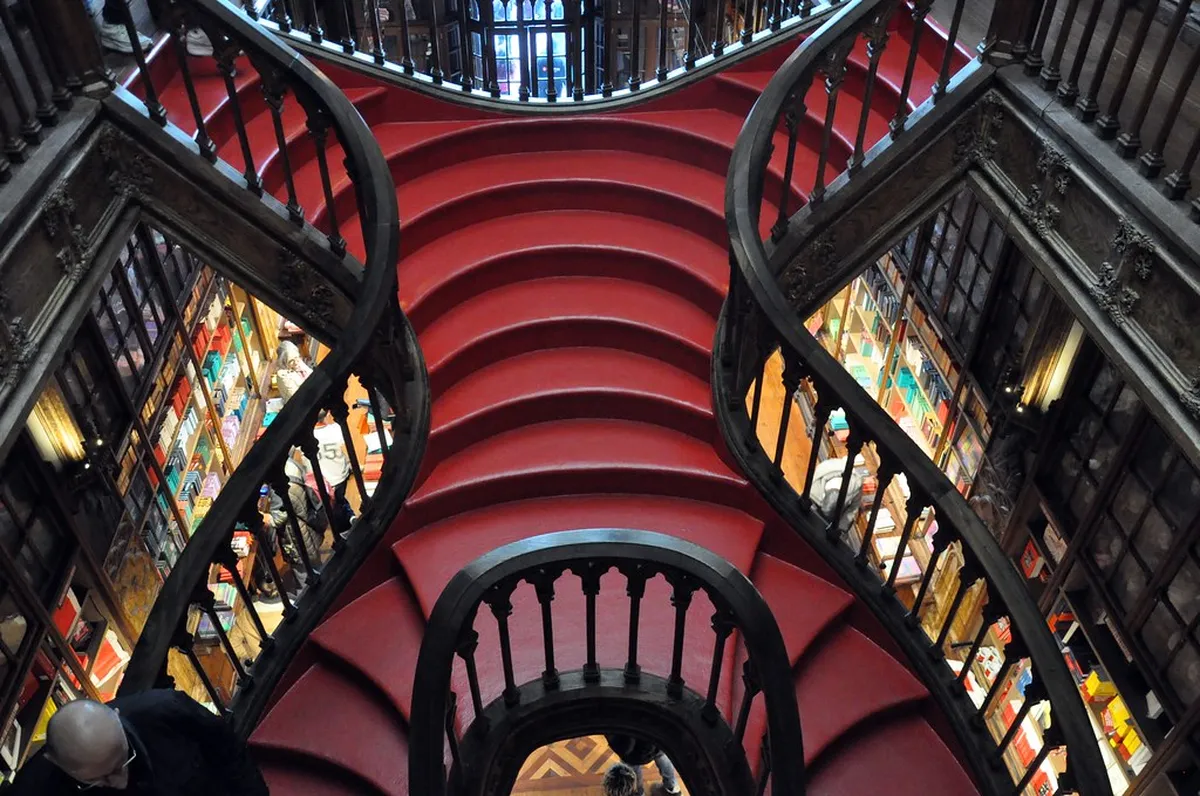 Porto Livraria Lello ornate neo-Gothic bookshop facade with carved stonework on a busy pedestrian street